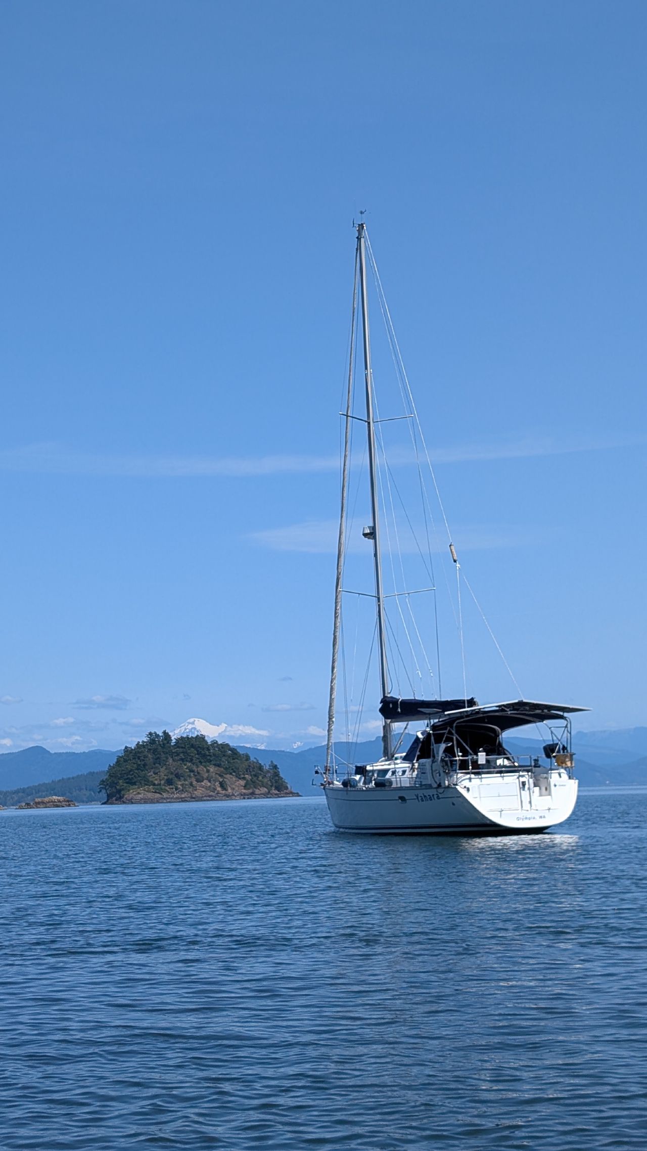 SV Yahara anchored in Eagle Harbor at Cypress Island with Mount Baker in the background