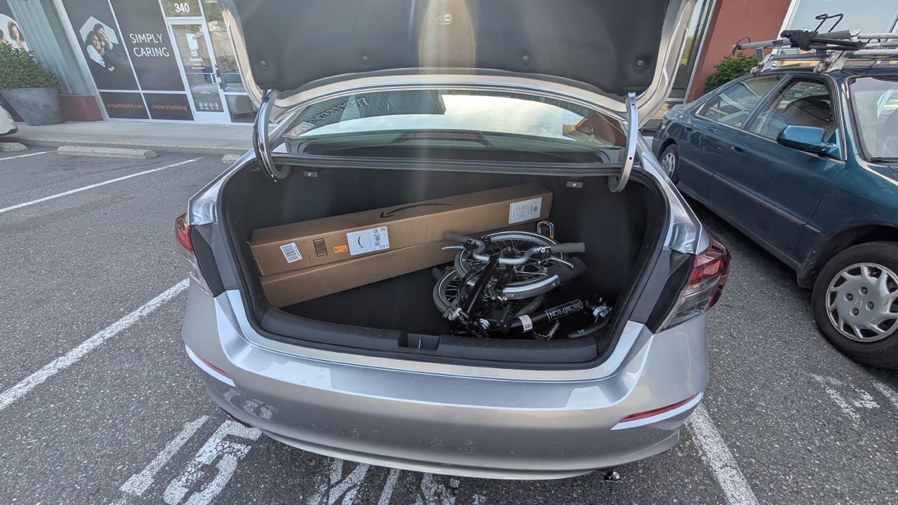 Brompton folding bike and watermaker parts in the trunk of the rental car in Bellingham