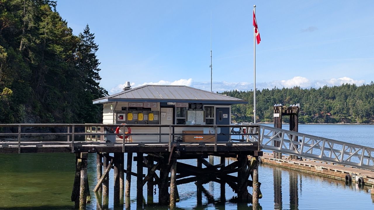 Canadian customs building on stilts with Canadian flag at Bedwell Harbour in the Gulf Islands