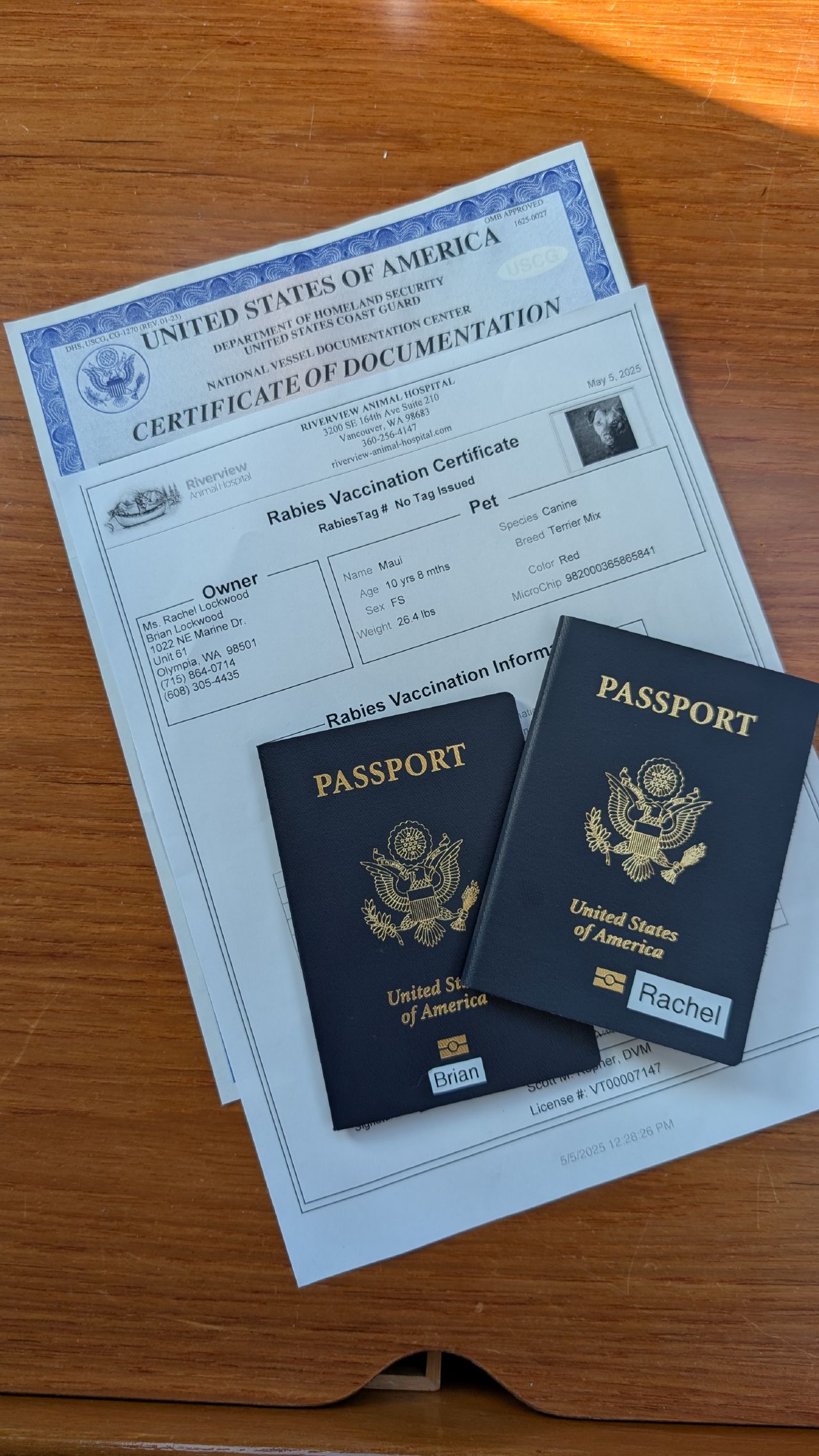 US passports, vessel documentation, and Maui’s rabies certificate ready for Canadian customs