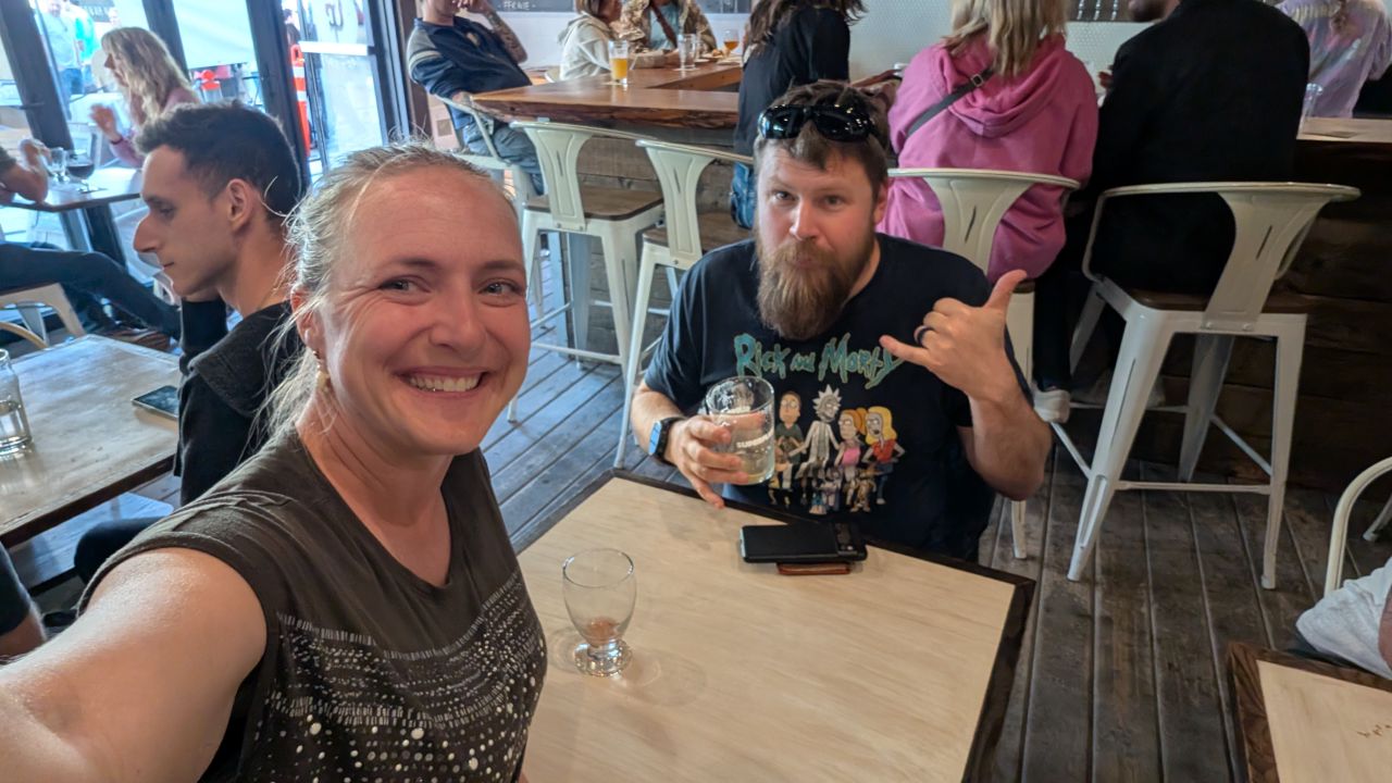 Rachel and Brian enjoying beers at a bar during the Nanaimo arts walk