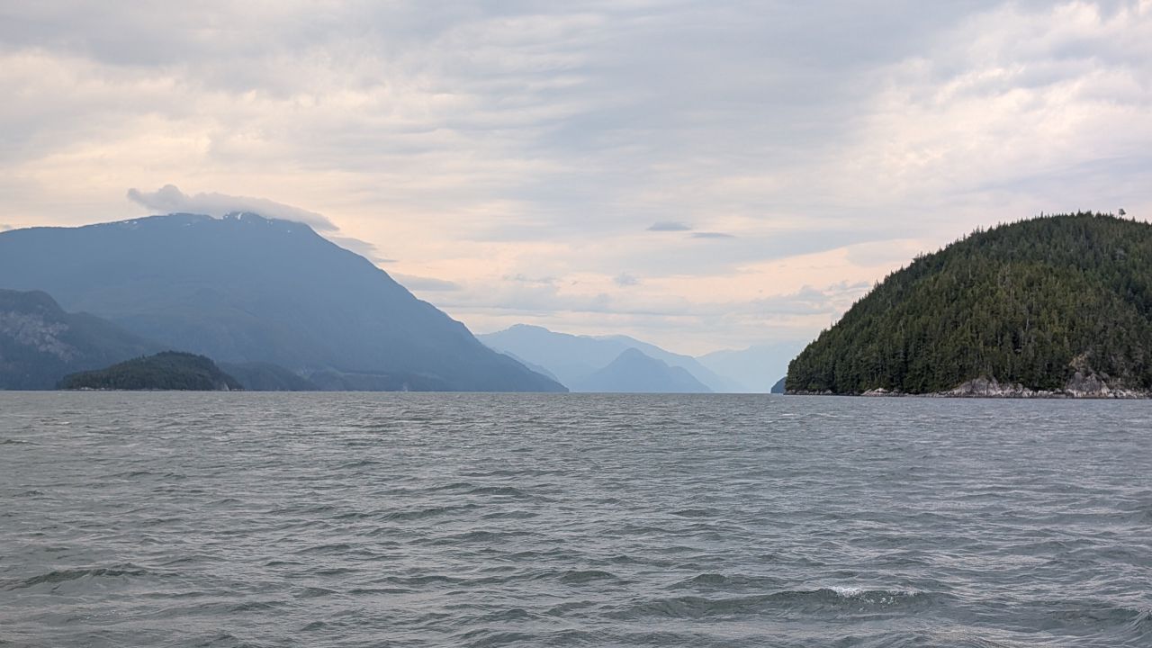 Hazy mountains and choppy water while motoring through Johnstone Strait