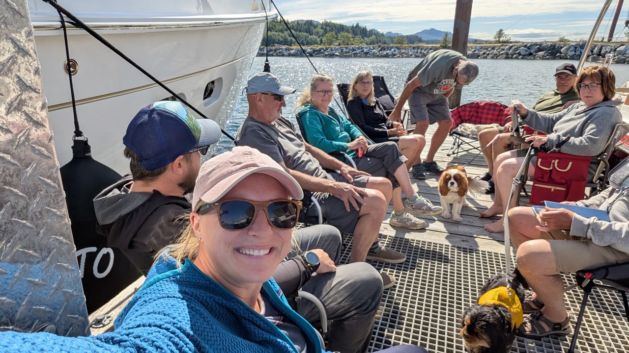 The flotilla crew gathering on the dock at Port McNeill with dogs