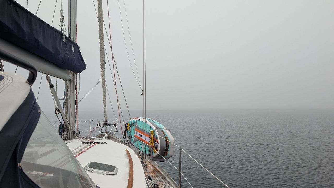 SV Yahara’s deck disappearing into dense fog during a passage north of Vancouver Island