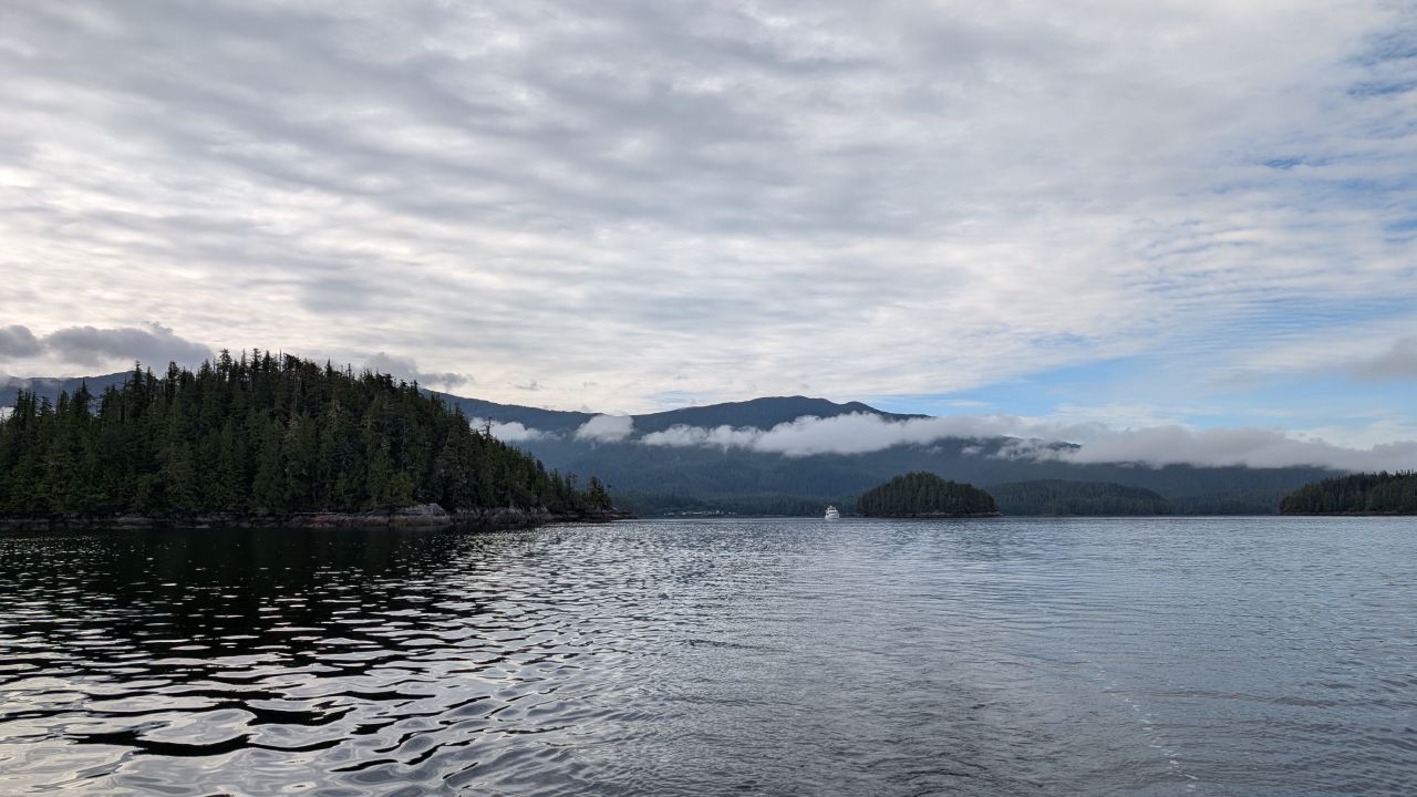 Forested islands with low hanging clouds during the passage to Codville Lagoon