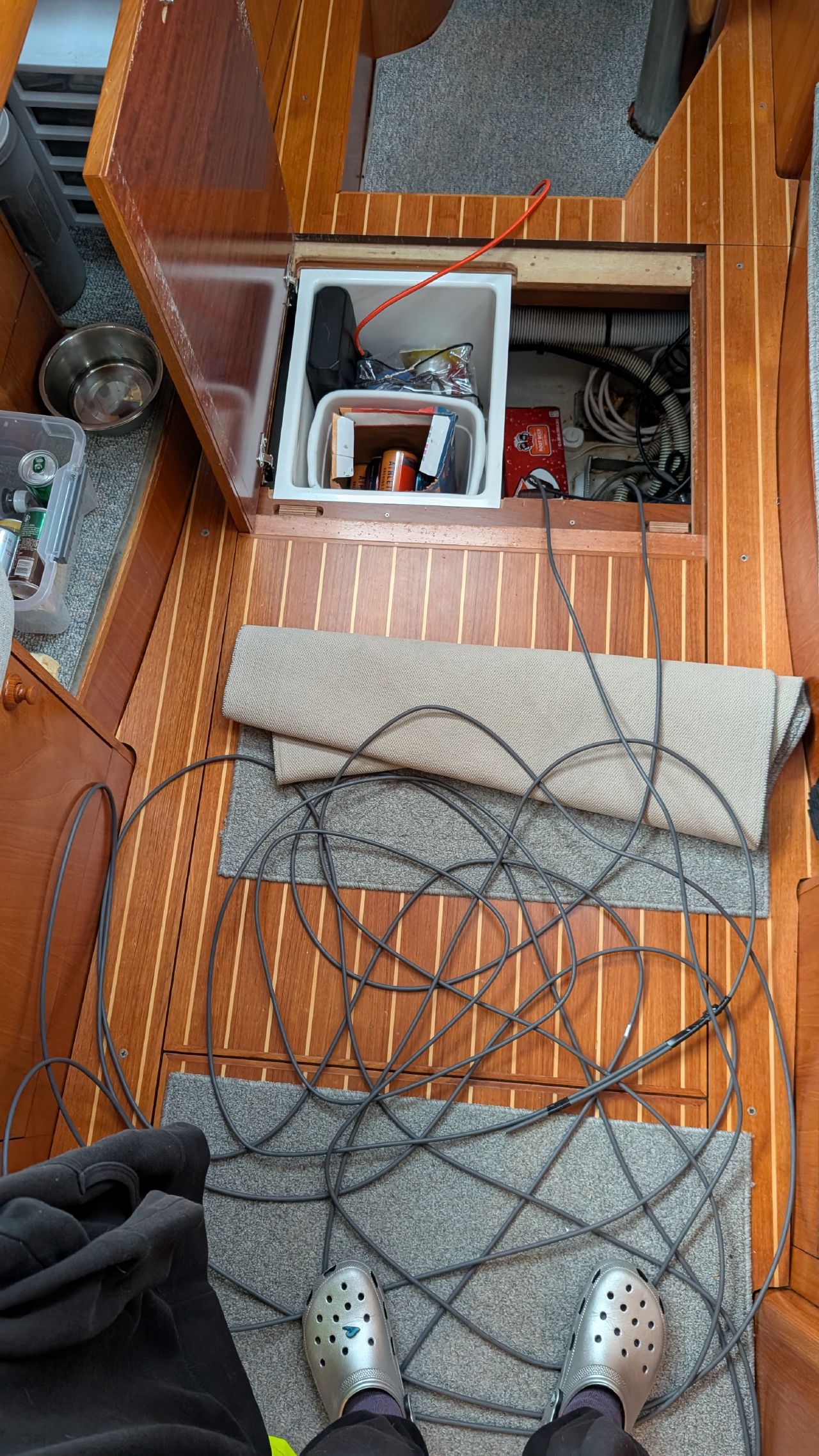New Starlink cable routed through the cabin floor with a floor panel removed