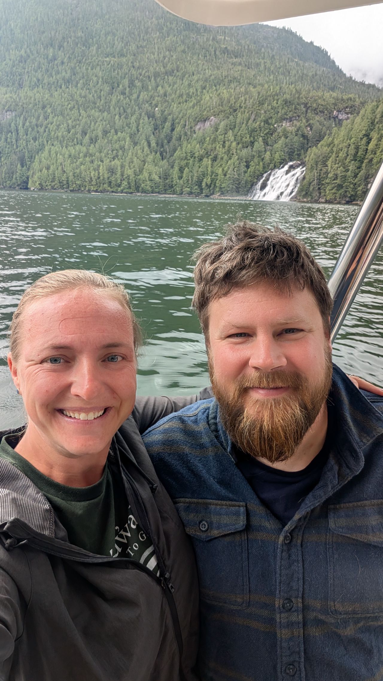 Rachel and Brian selfie with the epic Poison Cove waterfall in the background