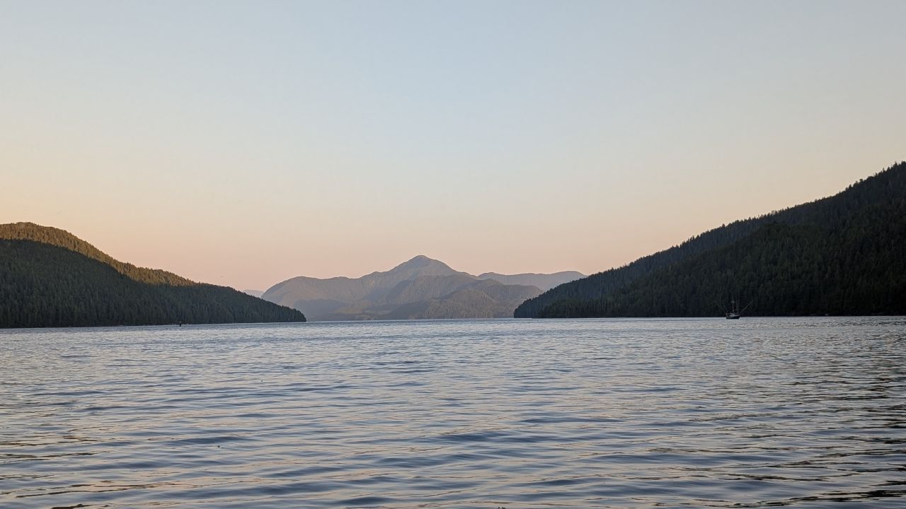 Pastel sunset over mountain silhouettes at Otter Shoal anchorage, our furthest point north