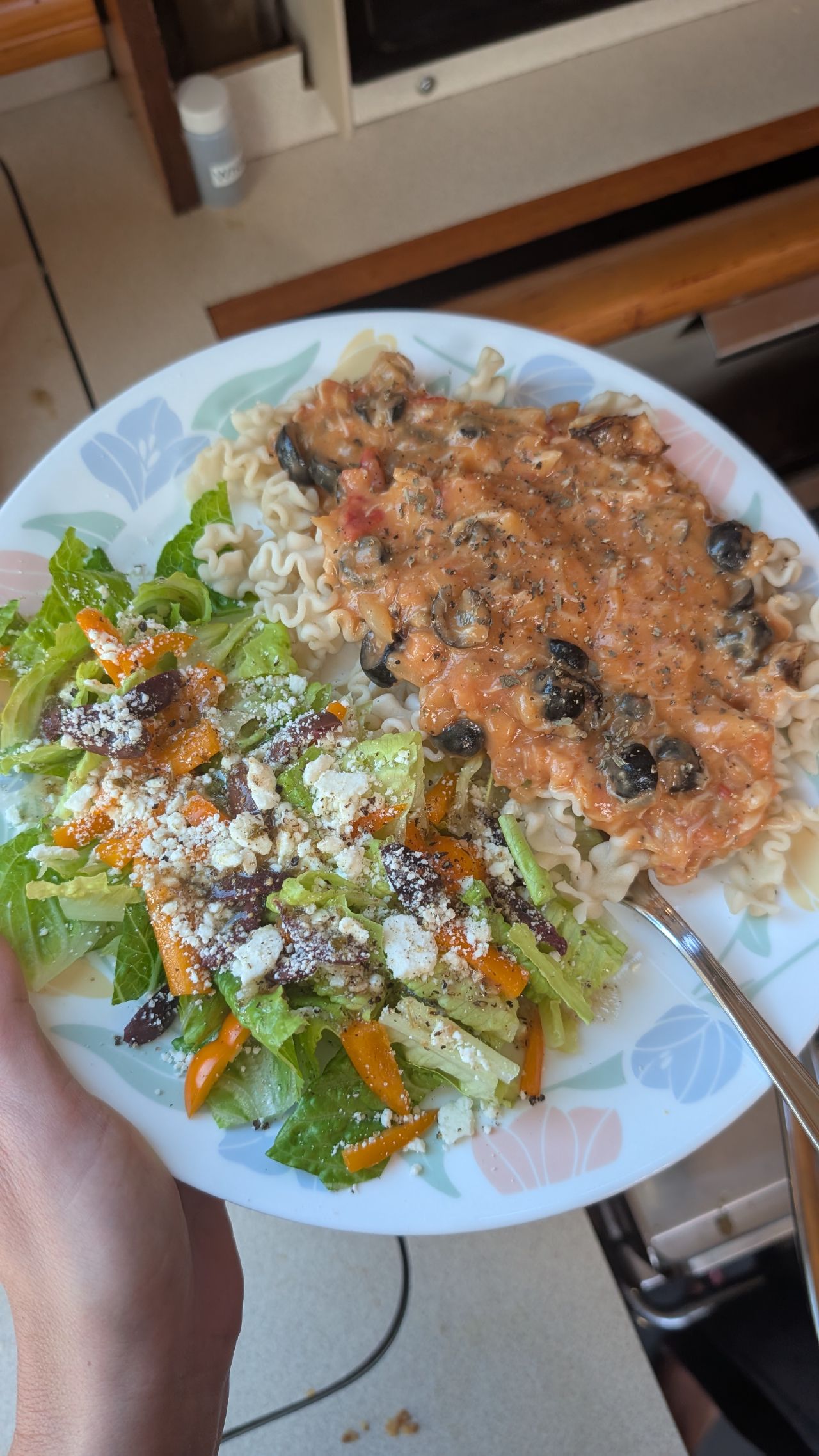 Crab and tomato pasta with a fresh salad made in the galley of SV Yahara