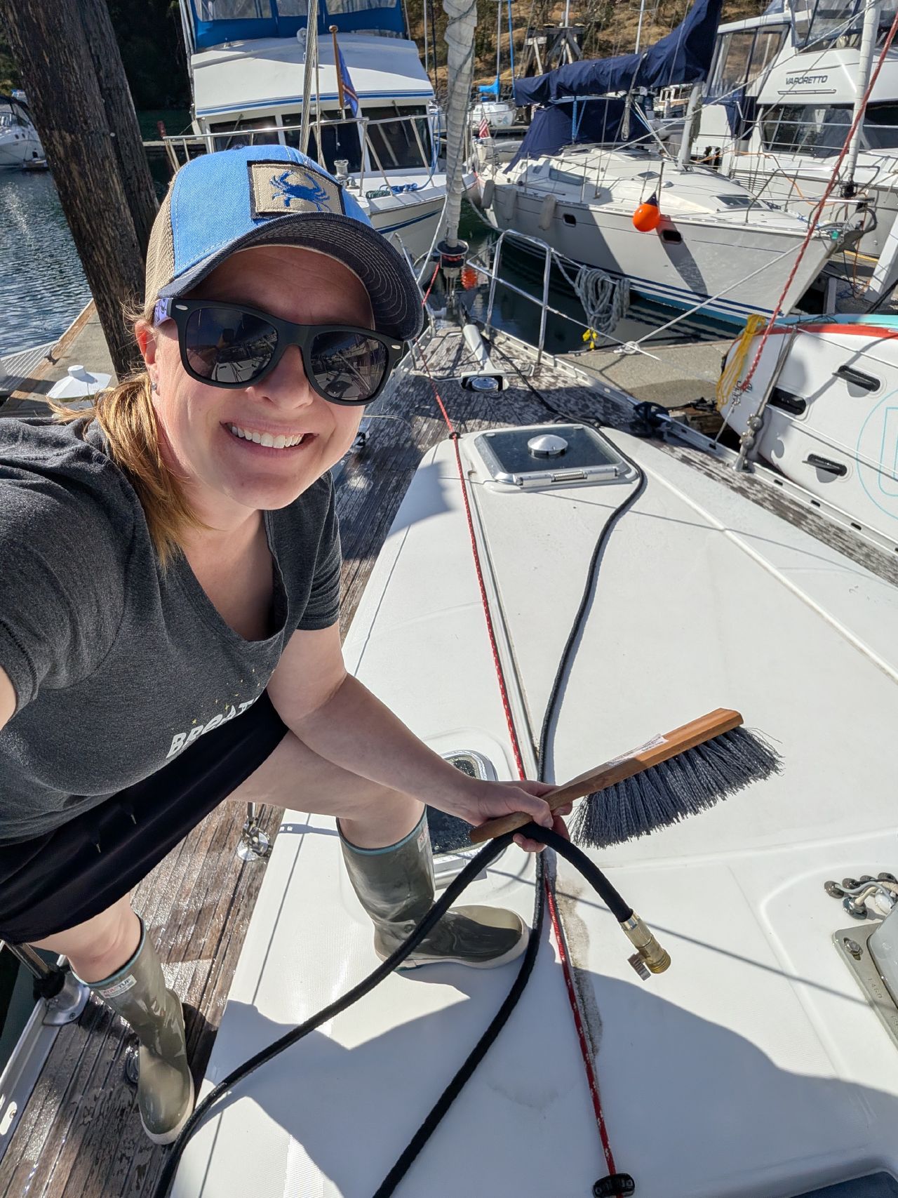 Rachel scrubbing the boat deck at the Friday Harbor dock