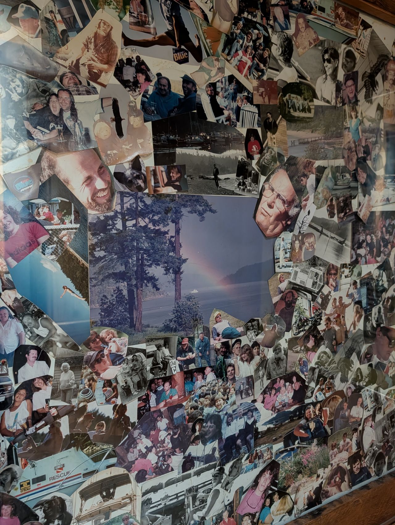 A wall covered in a collage of family photos