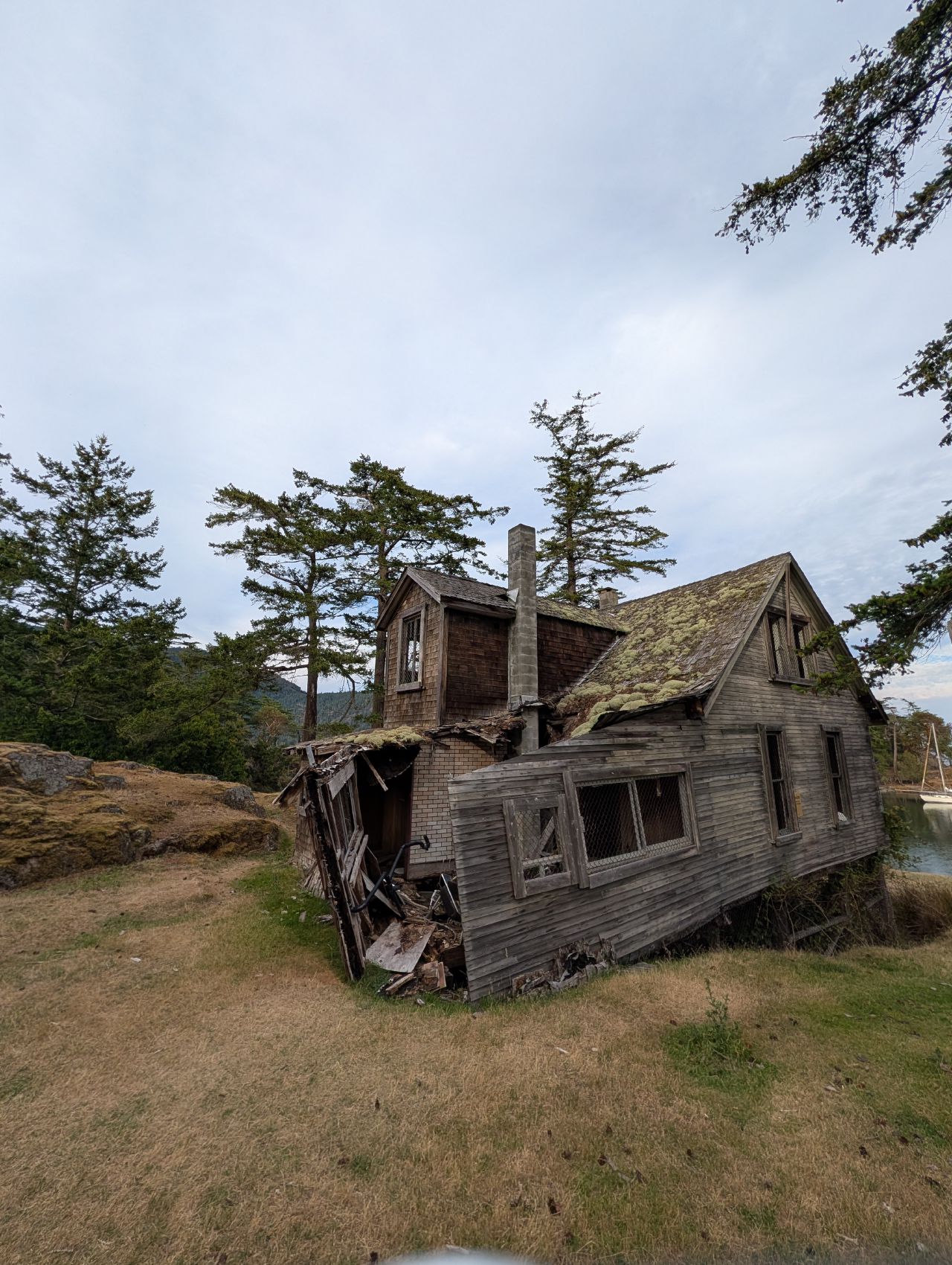 The weathered, leaning Palmer homestead cabin on Jedediah Island