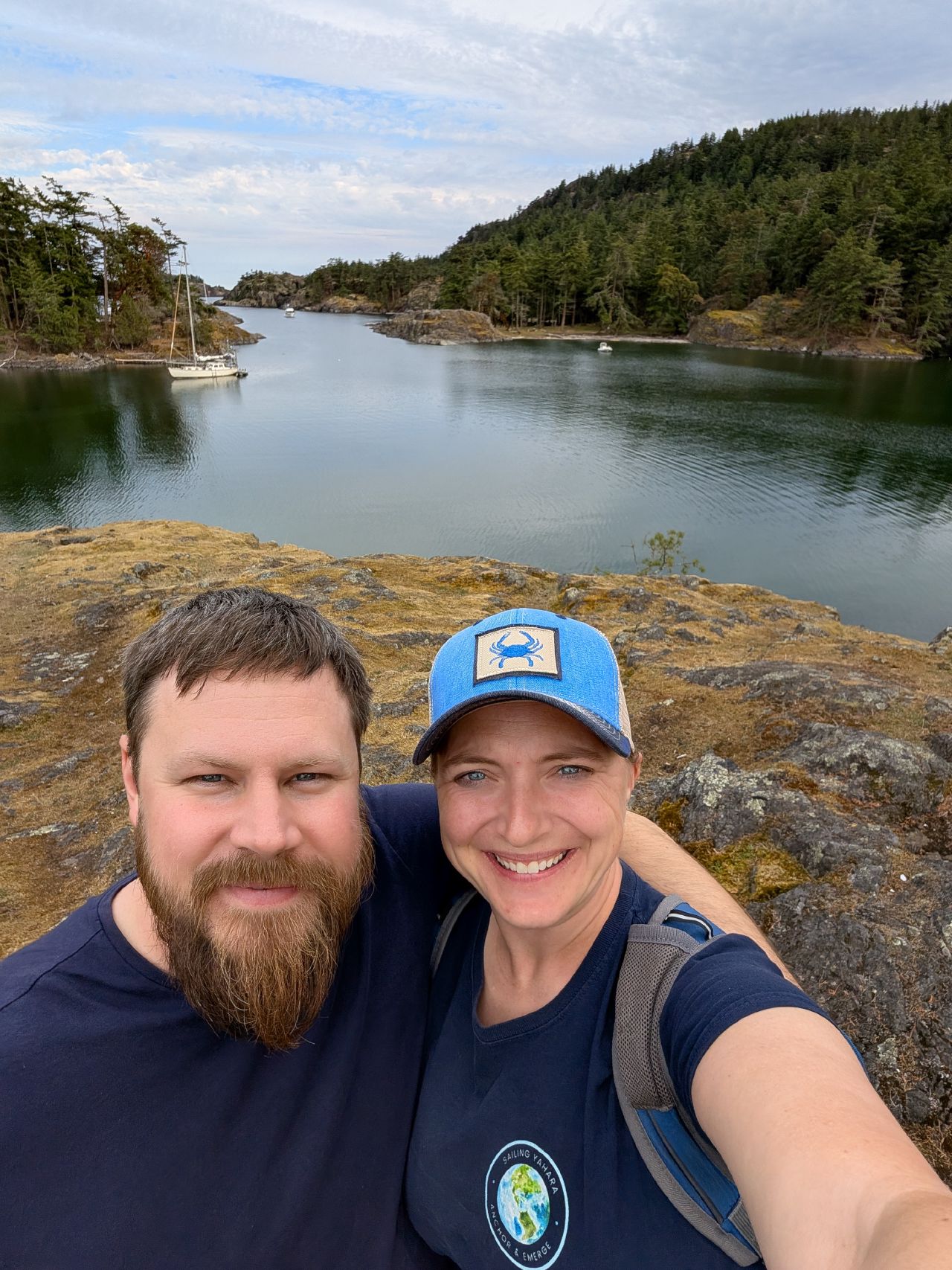 43% 79% Rachel and Brian at a rocky overlook above the anchorage