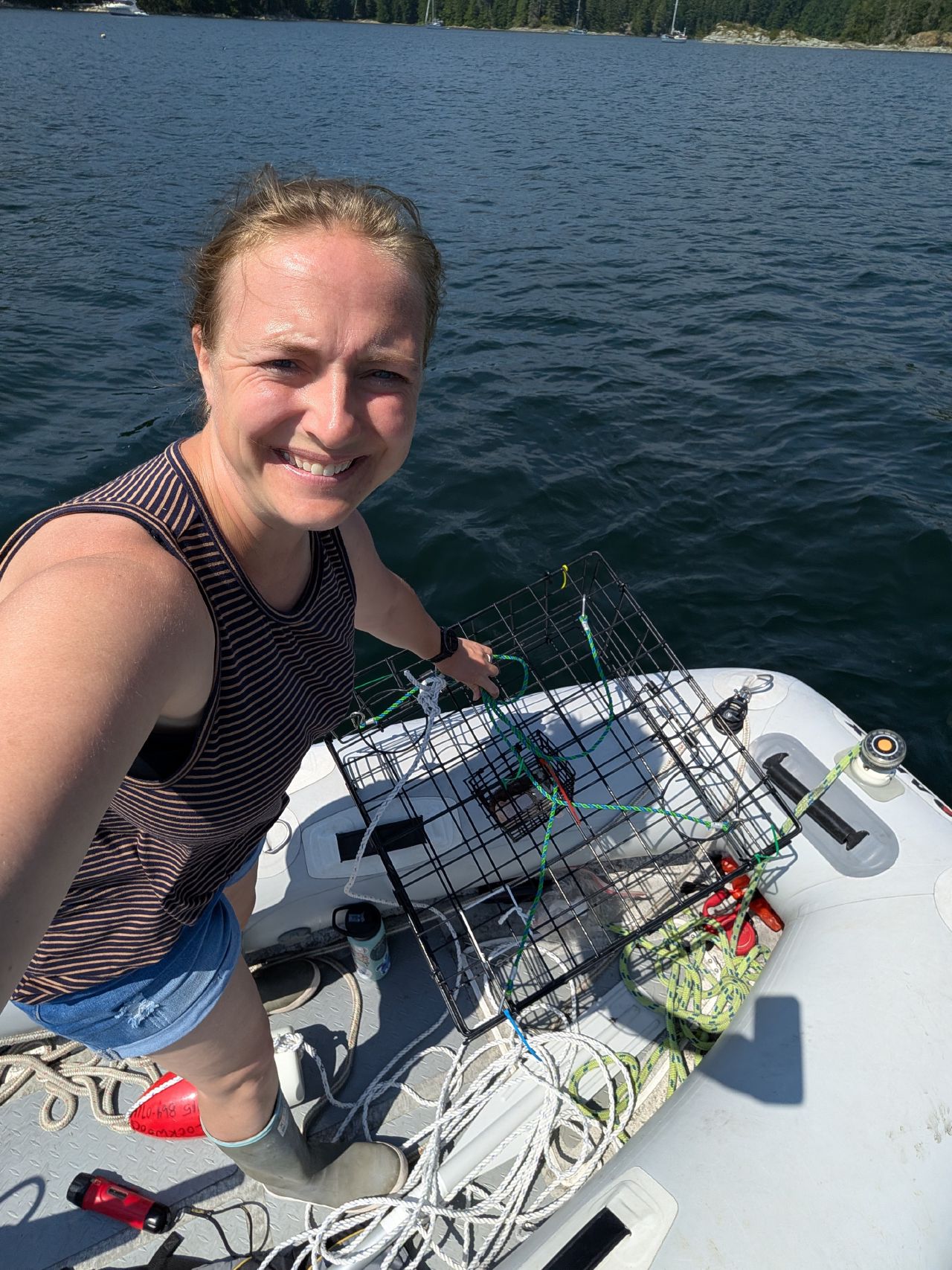 Rachel with a crab trap on the dinghy